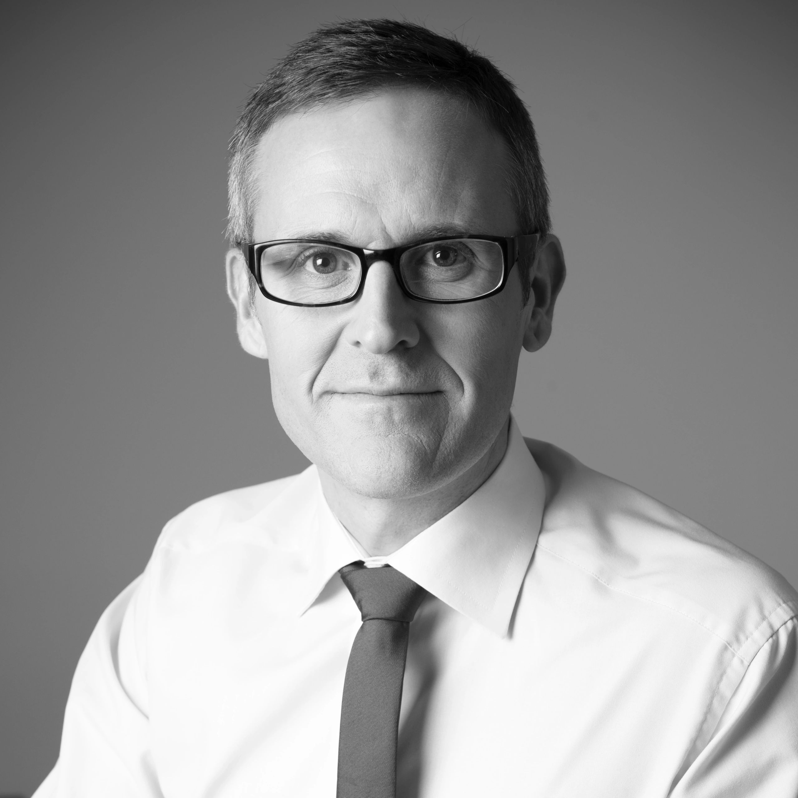 Professional headshot in black and white