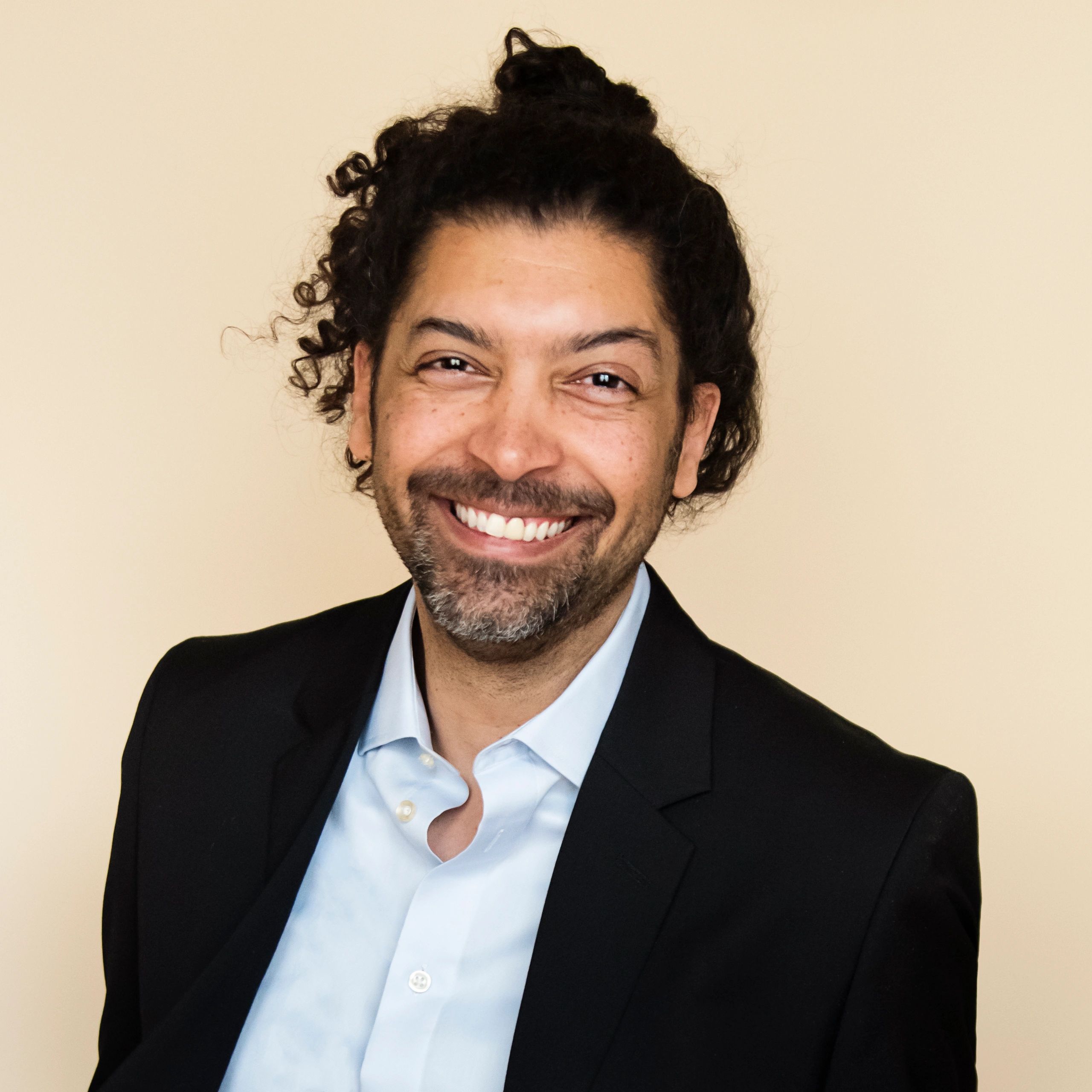 Professional headshot on neutral background