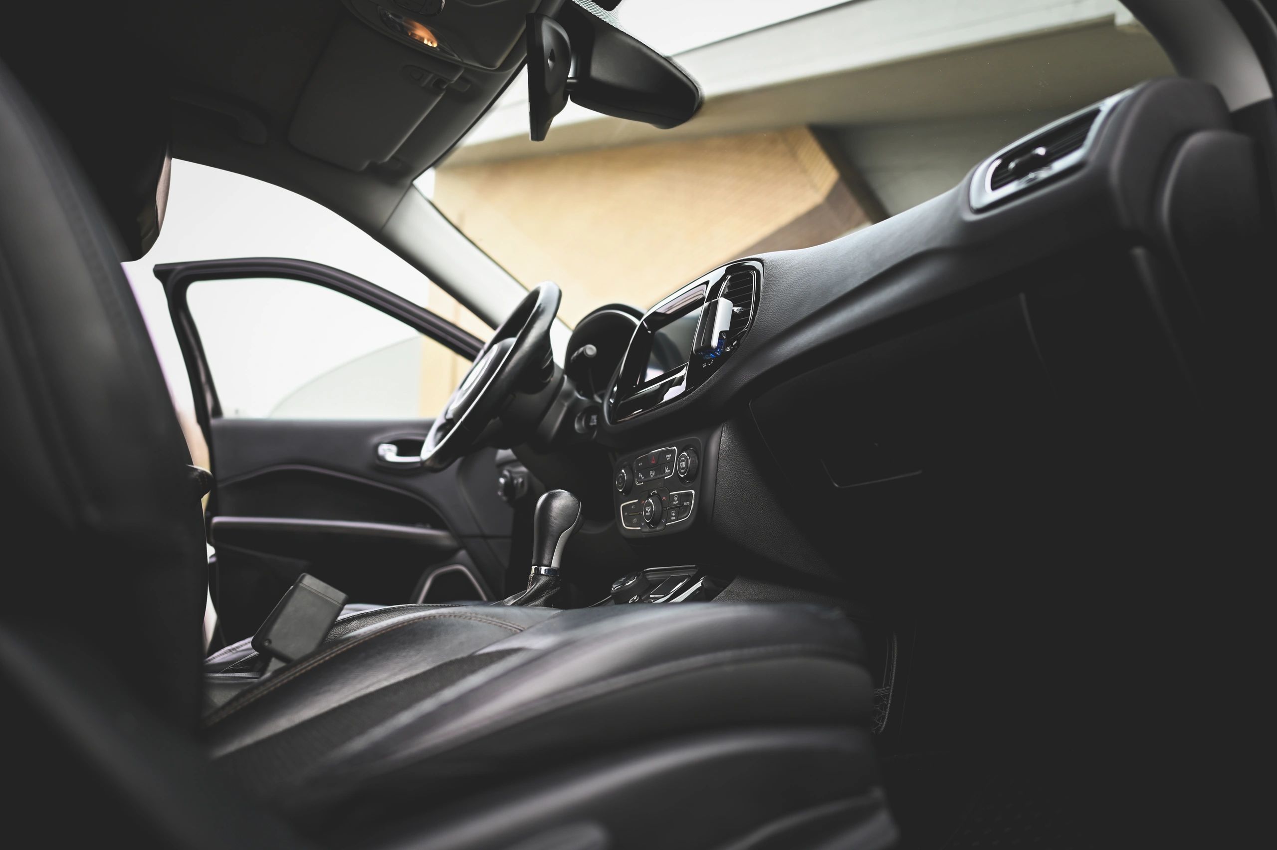 Luxury car interior detail representing high-end vehicle ownership and tailored insurance